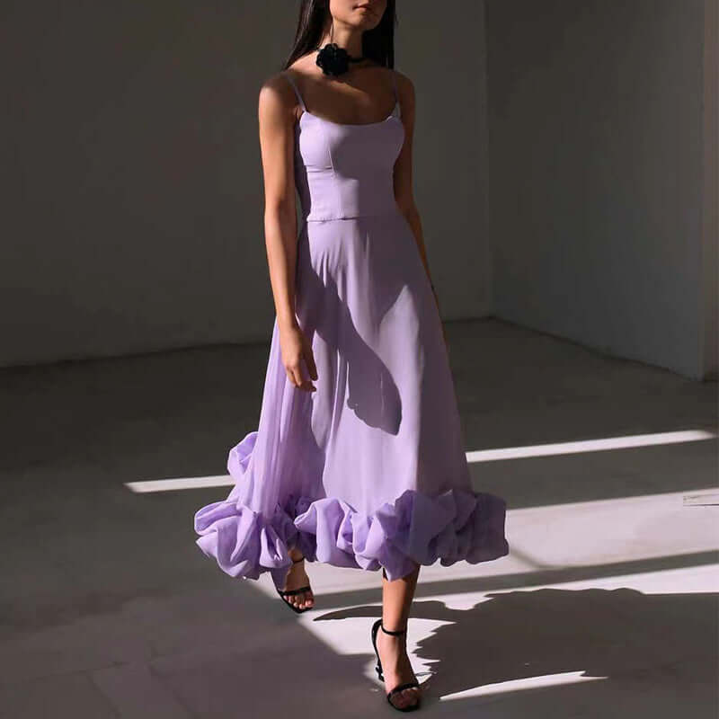 Elegant lavender dress with ruffled hem and spaghetti straps, perfect for stylish summer occasions.
