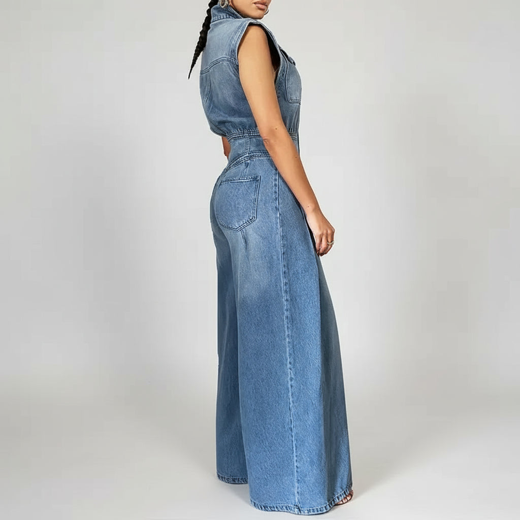 Blue denim jumpsuit back view showing button closure and fit