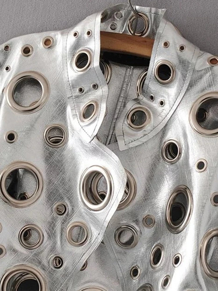 Metallic garment with circular cutouts 