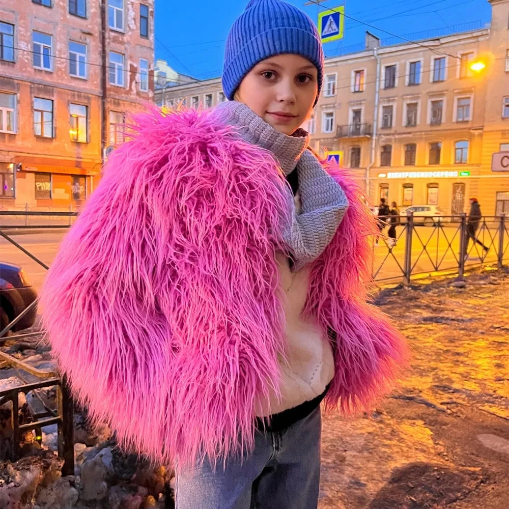 Person wearing a bright pink fur coat 