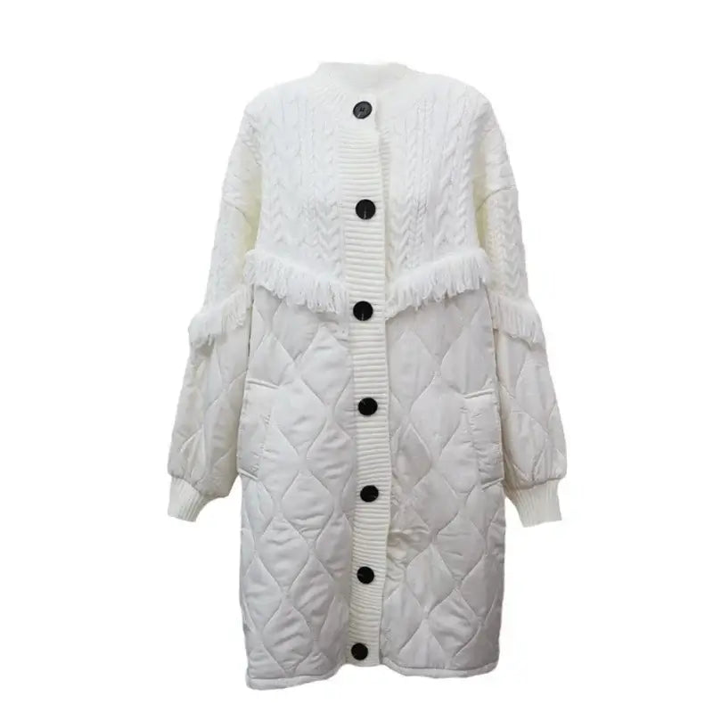 Women's white tassel knit long coat with button-up closure and quilted design, perfect for chilly weather style.