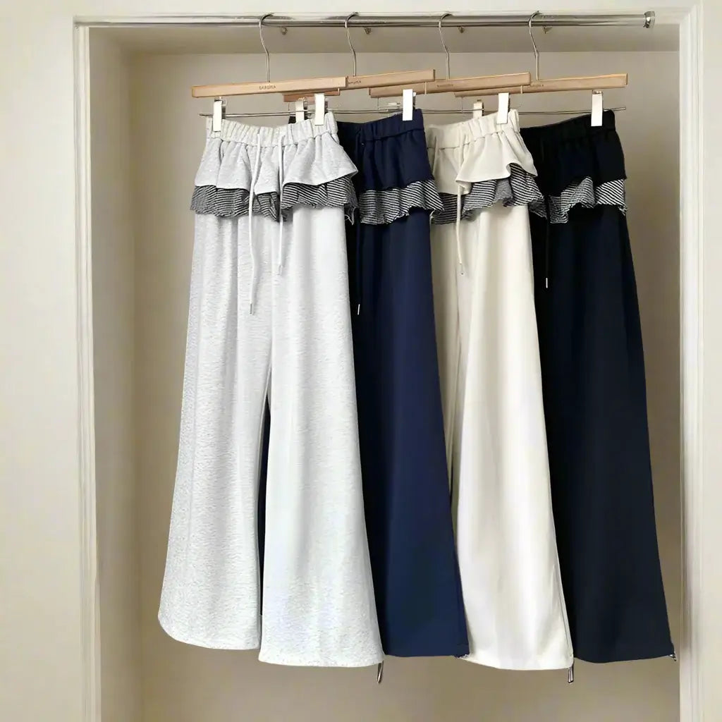 Women's wide-leg patchwork plaid pants in various colors, featuring a stylish ruffled waistband and comfortable fit.