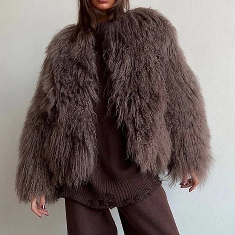 Person wearing a brown fluffy jacket.