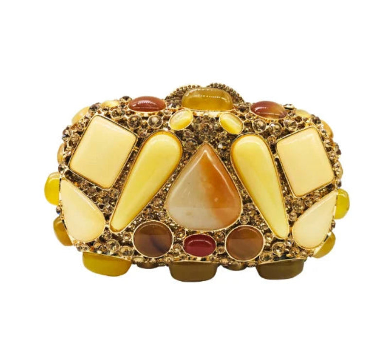 Decorative object with yellow, brown, and red stones.