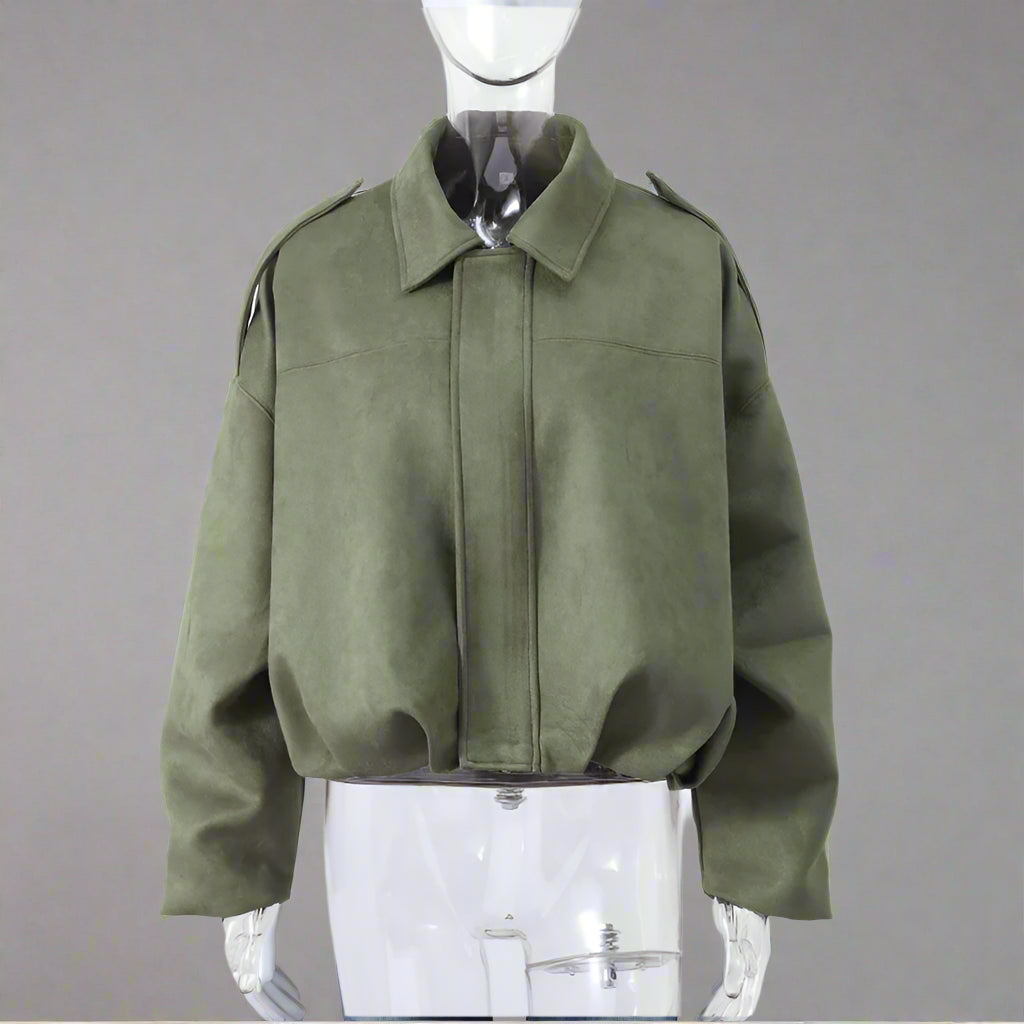 Green jacket on a mannequin.