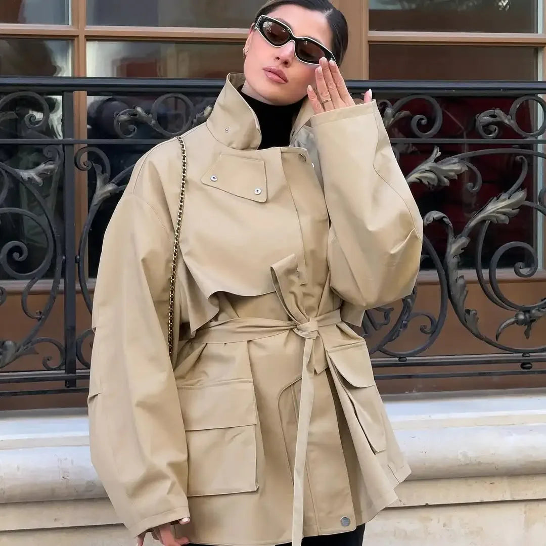 Women’s khaki belted short windbreaker coat with lapel, pockets, and long sleeves