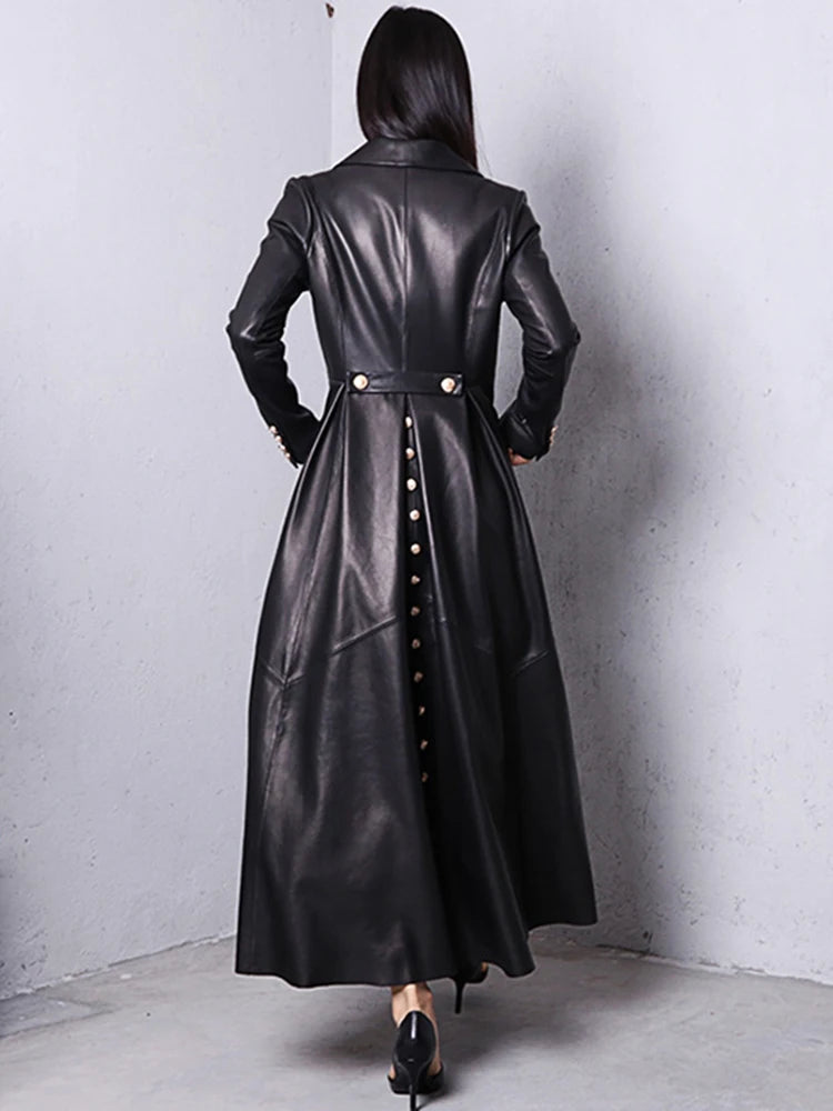 Person wearing a long black leather coat'