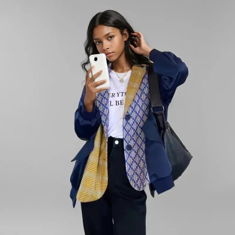Model showcasing a Women’s Color-Block Blazer with trendy loose fit and stylish design in a modern setting.