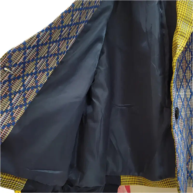 Inside view of stylish Women’s Color-Block Blazer showcasing bold patterns and chic lining design.