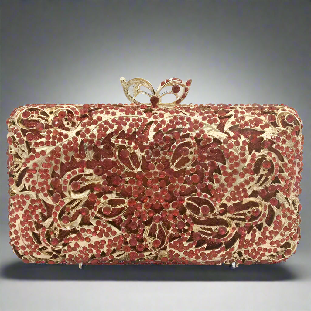 Red and gold floral patterned clutch bag.