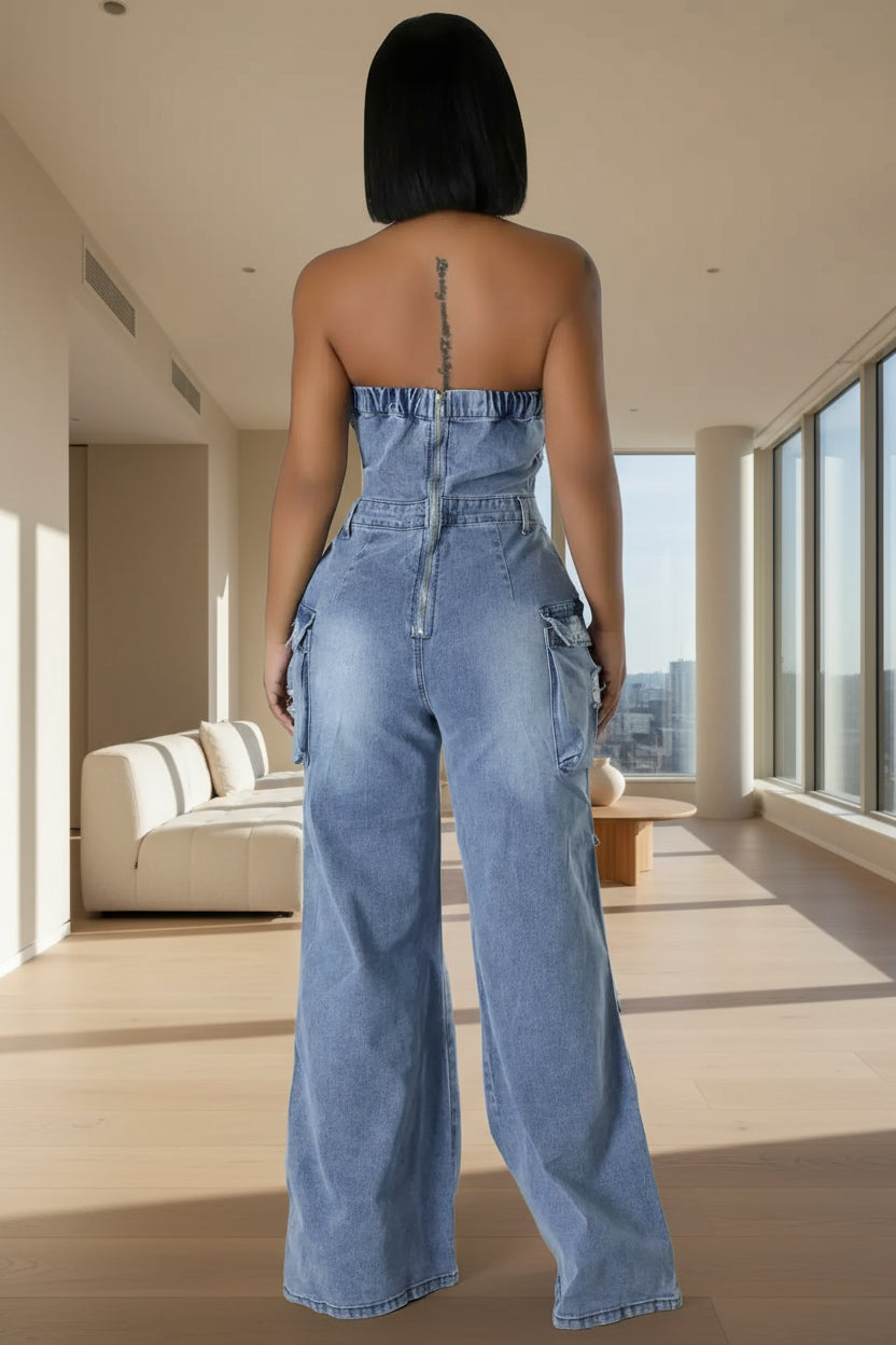 Person wearing a strapless denim jumpsuit 