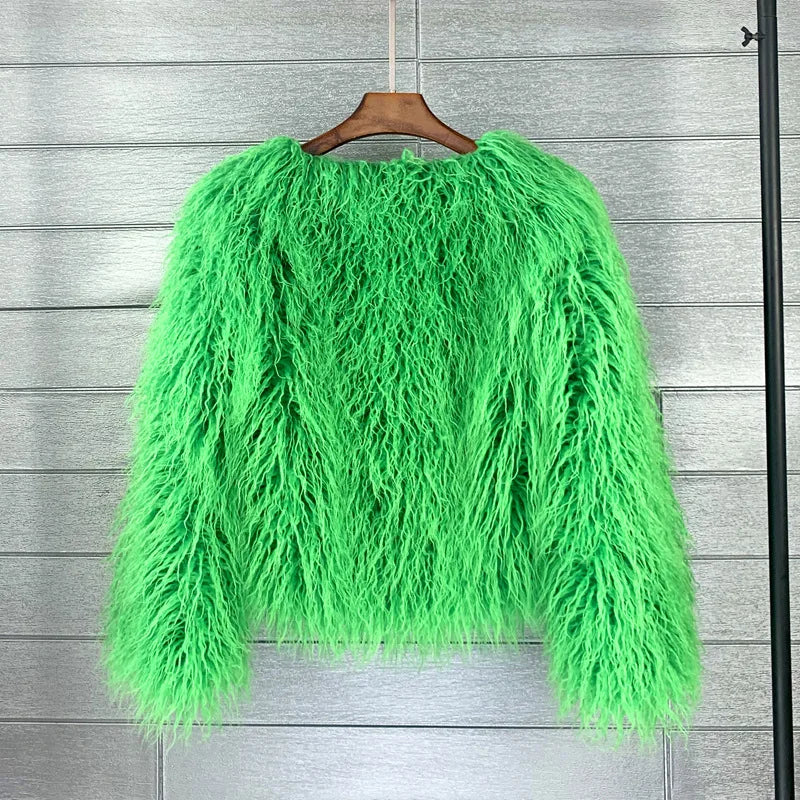 Green fluffy sweater on a hanger 