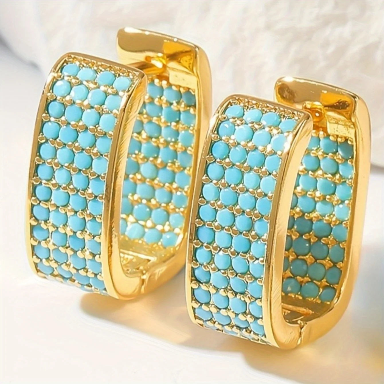 Gold hoop earrings with turquoise stones