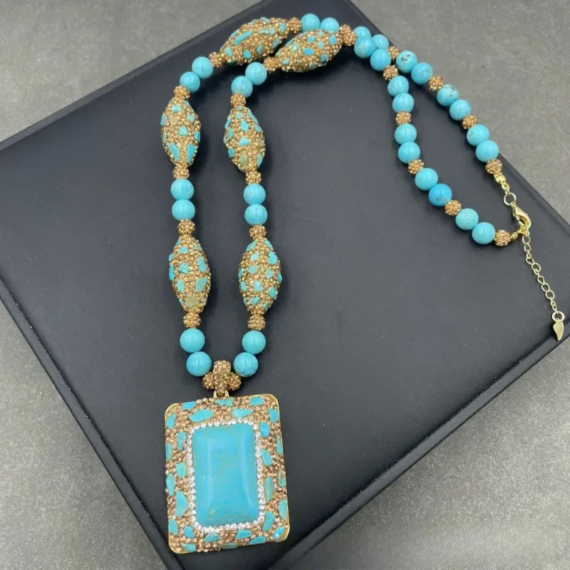 Turquoise beaded necklace with gold accents.