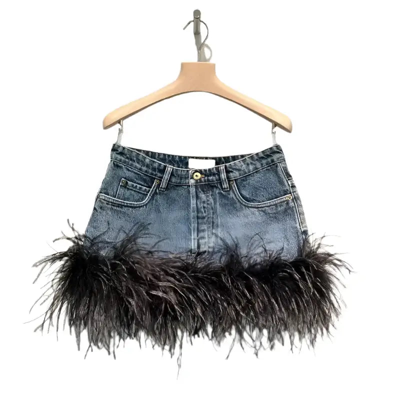 Trendy high-waist denim skirt with spliced feather edge, perfect for bold fashion and casual outings.