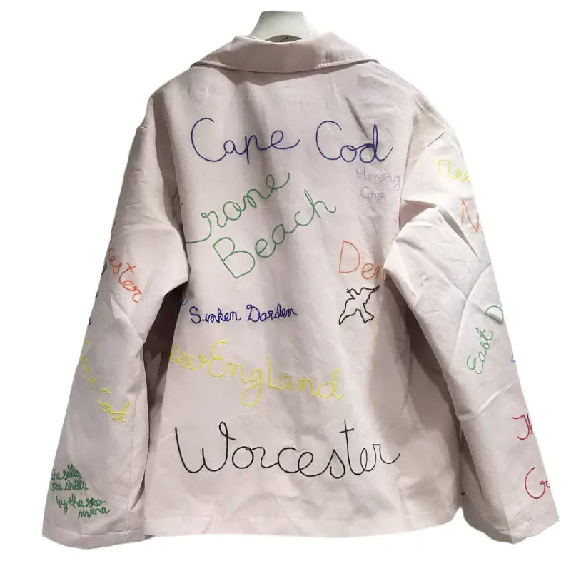 Trendy women's denim jacket with colorful lettering design, featuring Cape Cod and Worcester, perfect for spring fashion.