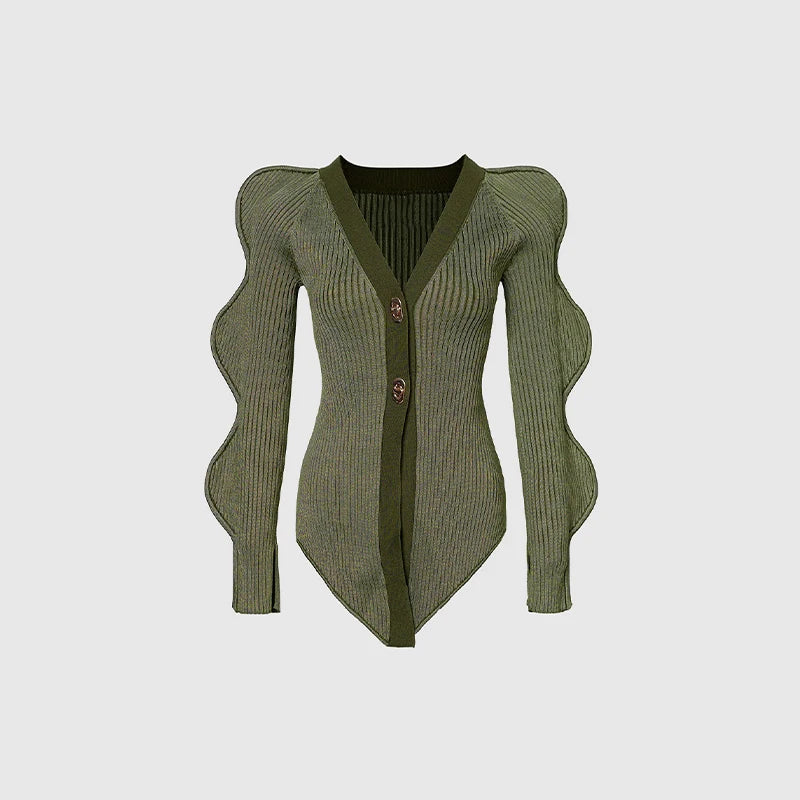 Green ribbed sweater with wavy sleeves.