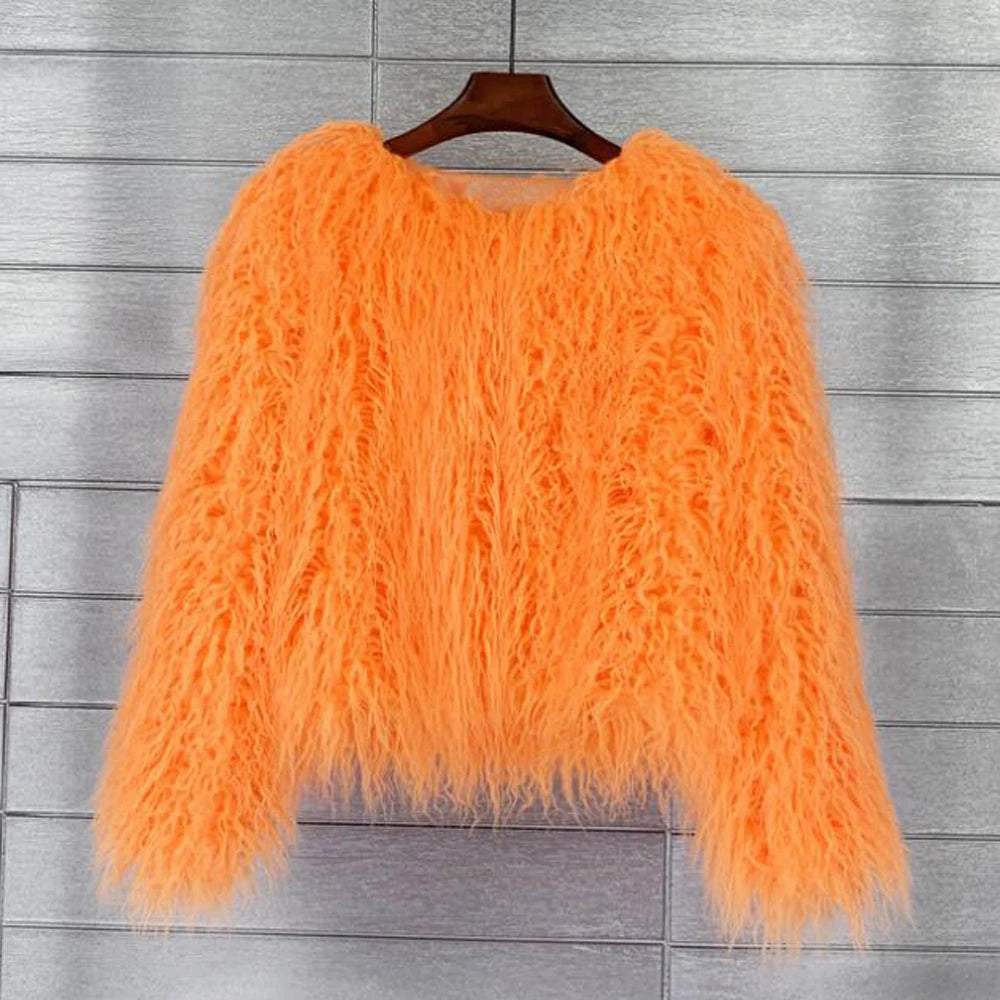 Orange fluffy sweater on a hanger 