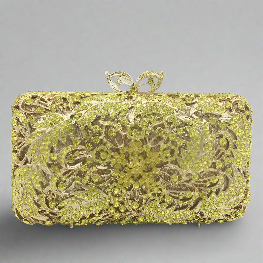 Decorative clutch bag with intricate design and gold accents.