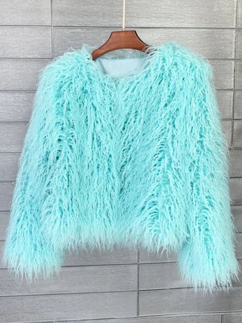 Turquoise fluffy jacket on a wooden hanger 