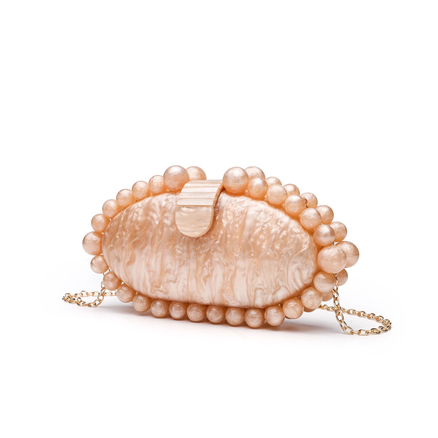 Shell-shaped handbag with pearl embellishments.