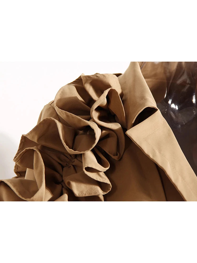 Close-up of a brown coat with ruffled collar