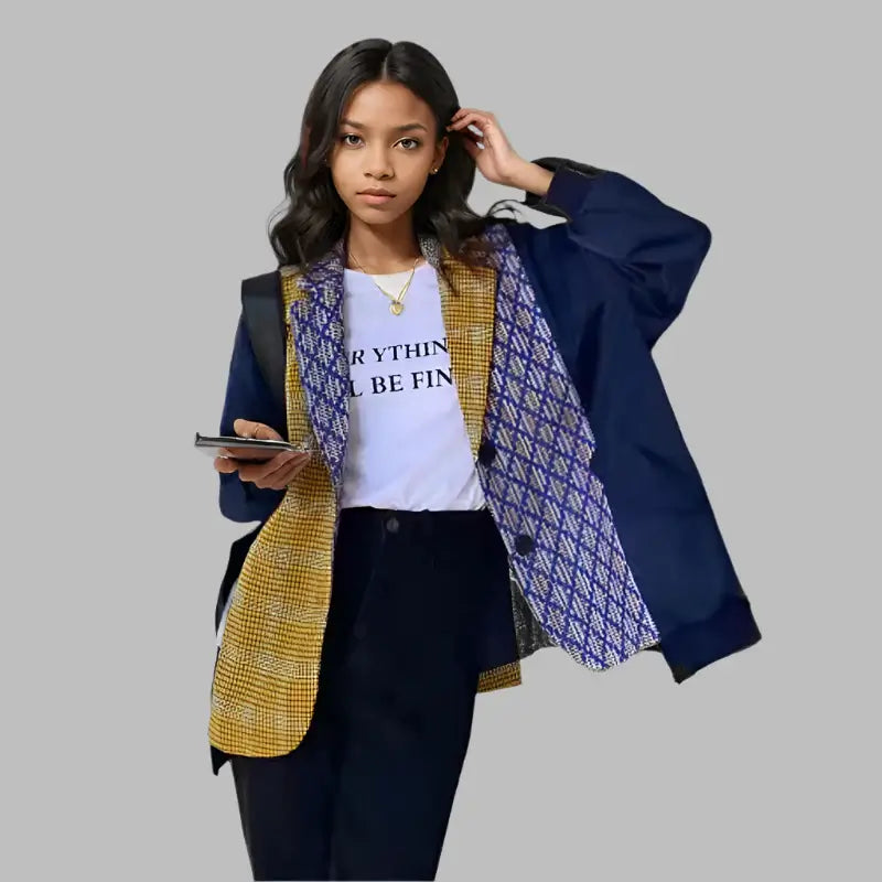 Model showcasing a women’s trendy color-block blazer with a loose fit, paired with a casual t-shirt and stylish pants.