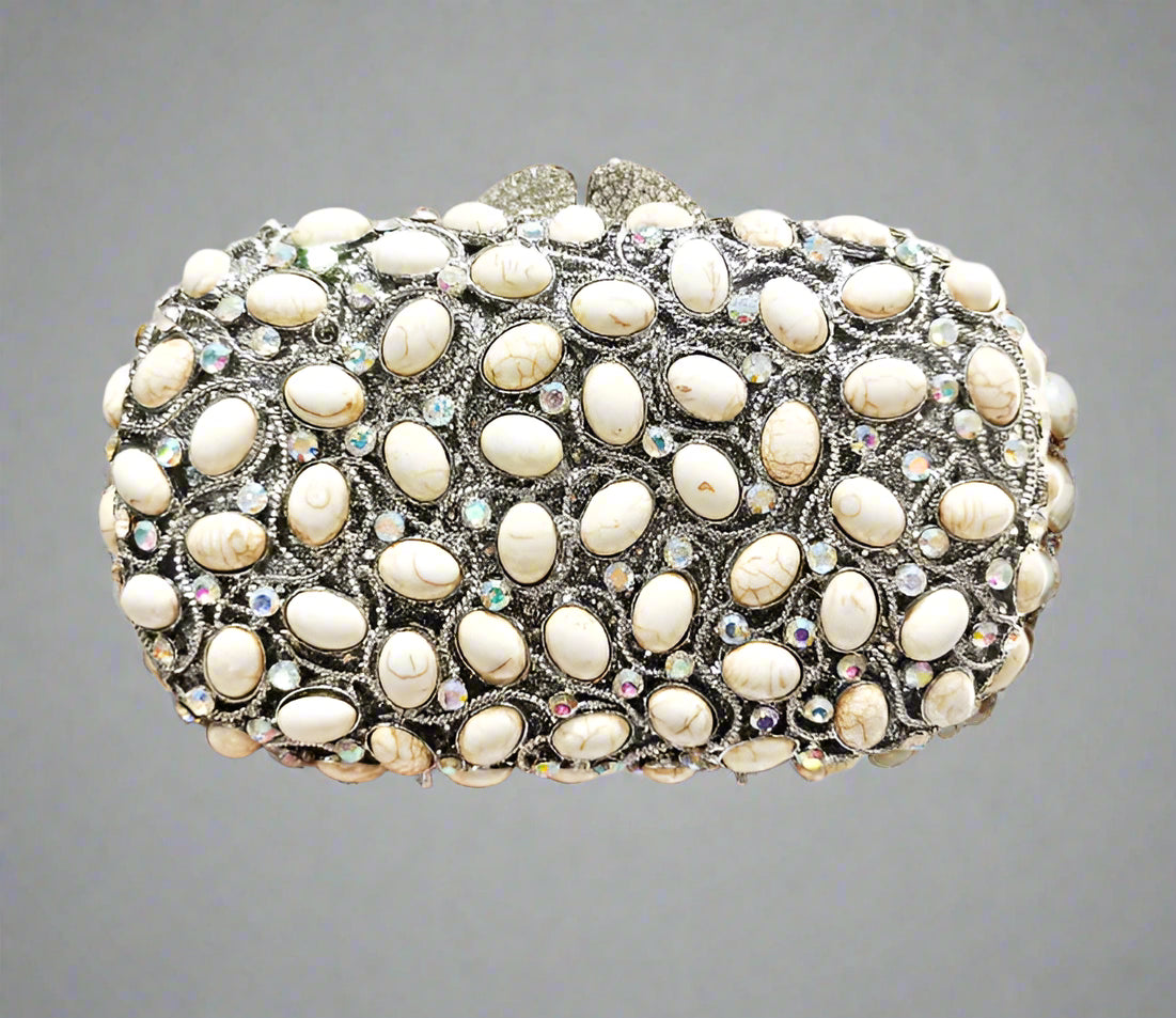 Elegant clutch bag with pearl-like stones.