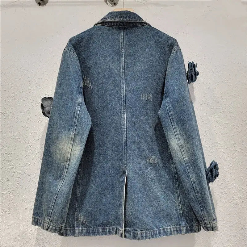 Back view of Women's 3D Floral Embroidered Relaxed Denim Blazer showcasing denim fabric and floral details.