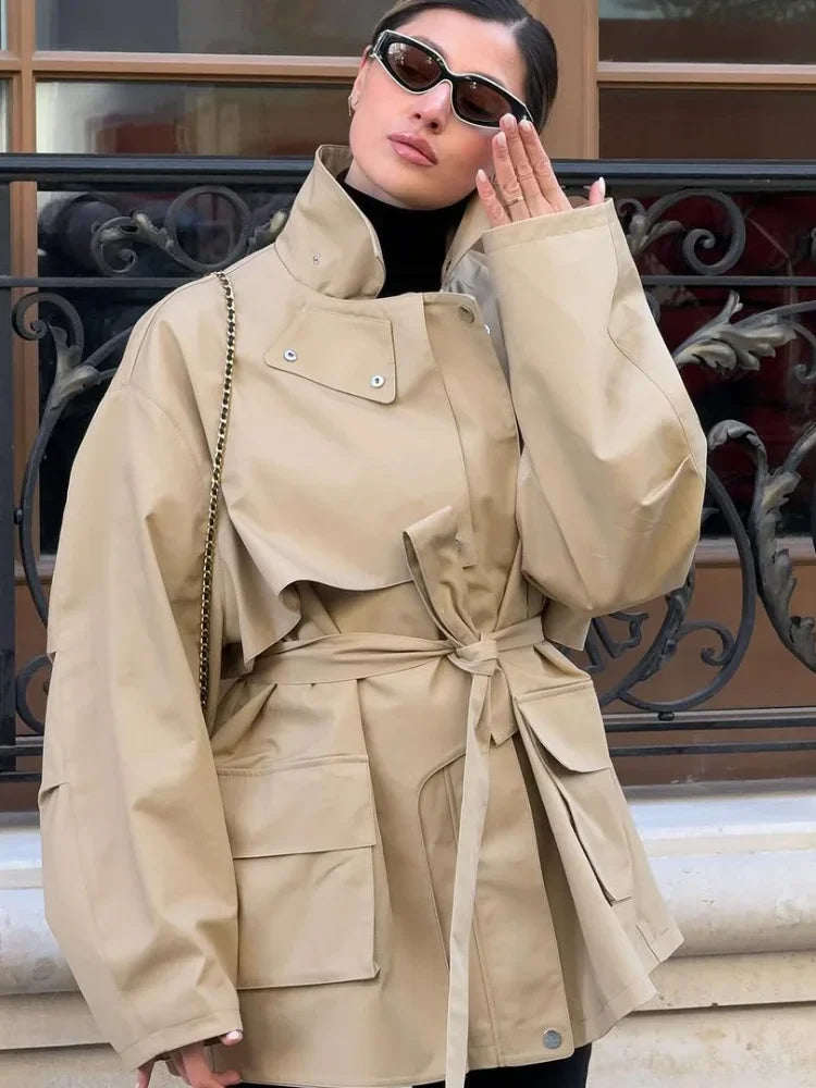 Women’s khaki belted short windbreaker coat with lapel, pockets, and long sleeves