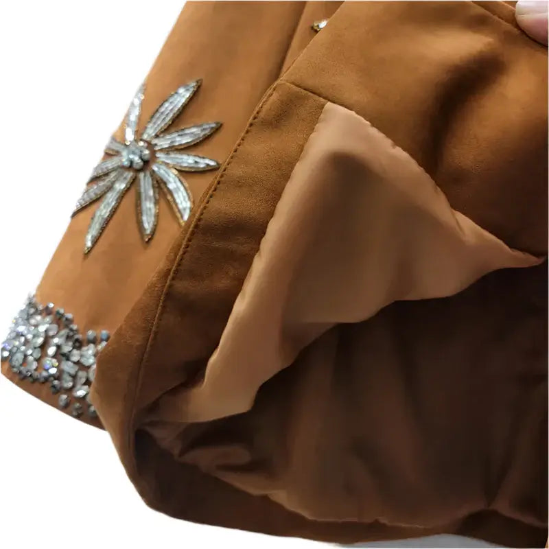 Close-up of Women's Rivet Flower Loose Casual Jacket showing floral embellishment and interior lining.