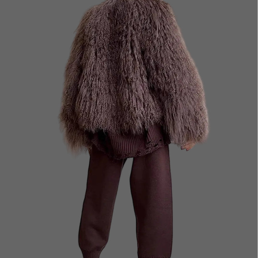 Person wearing a fluffy brown jacket.