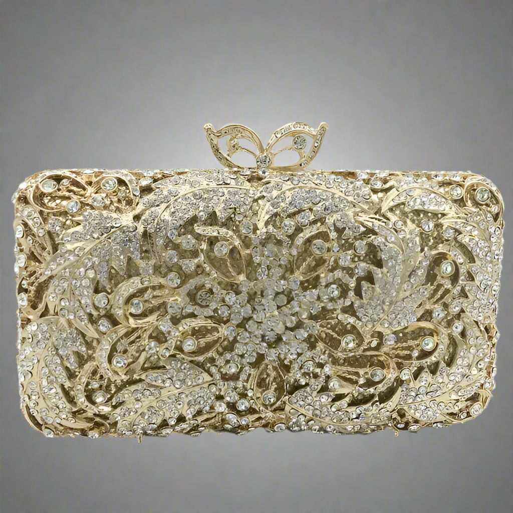 Decorative clutch bag with intricate gold and silver design.
