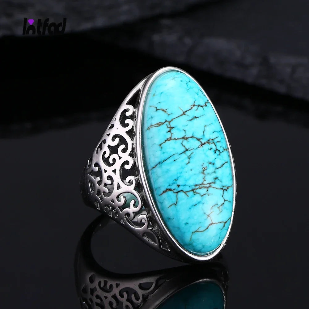 Turquoise stone ring with silver filigree design.