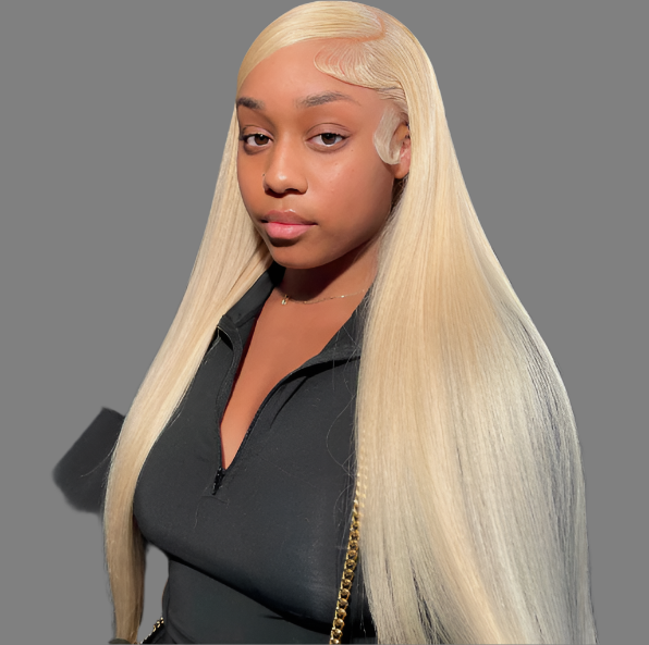 A person with long, sleek platinum blonde hair poses against a neutral gray background. They wear a black top and a subtle gold chain. The transparency of their HalleBeauty Lavender Lace Front Wig - 13x6 Straight Human Hair (Pre-Plucked) enhances their calm, direct expression and adds effortless elegance.