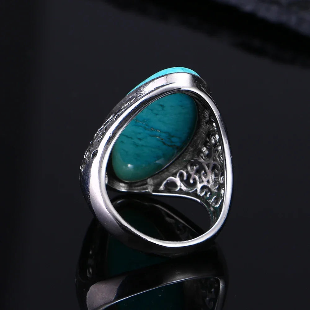 Silver ring with a turquoise stone.