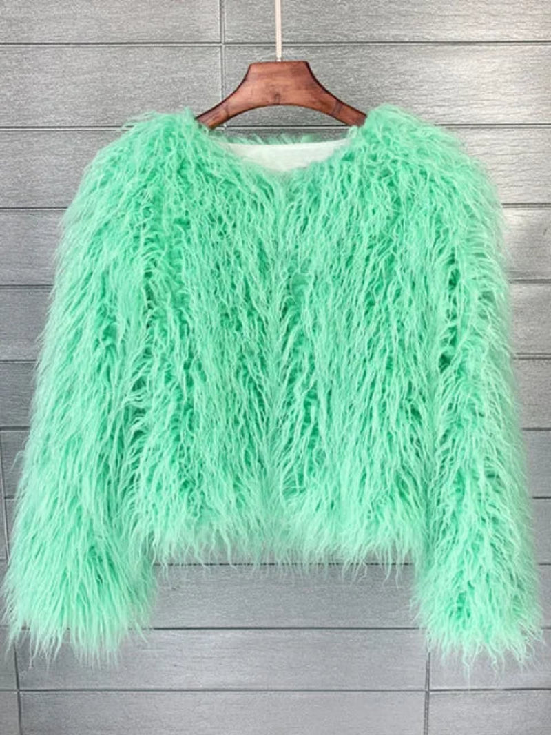 Mint green fluffy jacket on a wooden hanger