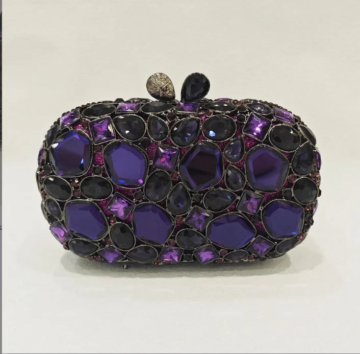 Elegant clutch bag with purple and black gemstones.
