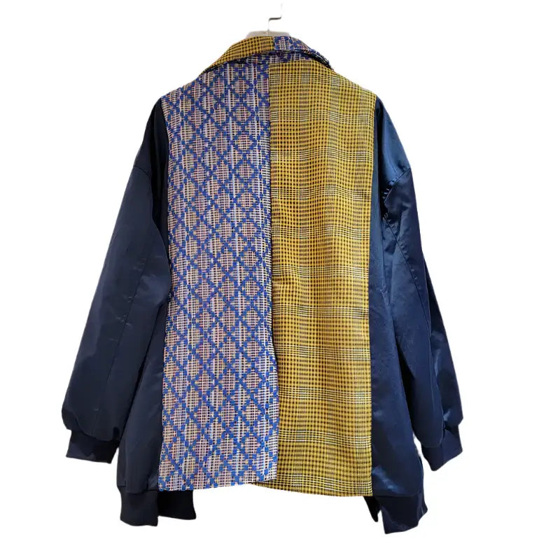 Back view of a Women's color-block blazer featuring blue and yellow patterned fabric, stylish and modern design.