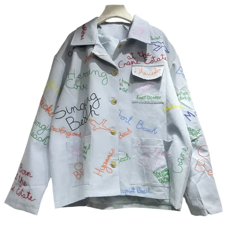Trendy women's colorful letter denim jacket with spliced design and turn-down collar for spring style.