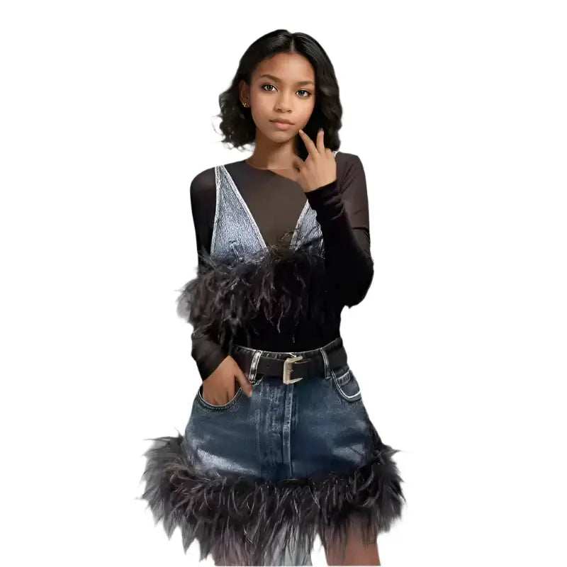 Trendy women's denim vest and skirt set with spliced feather edge, V-neck sling, and high waist for a stylish look.