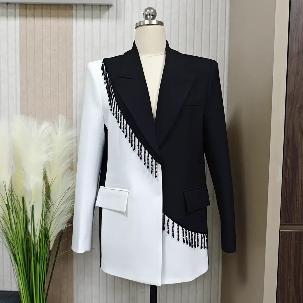 Colorblock patchwork tassel blazer for women featuring black and white design with playful tassel accents.