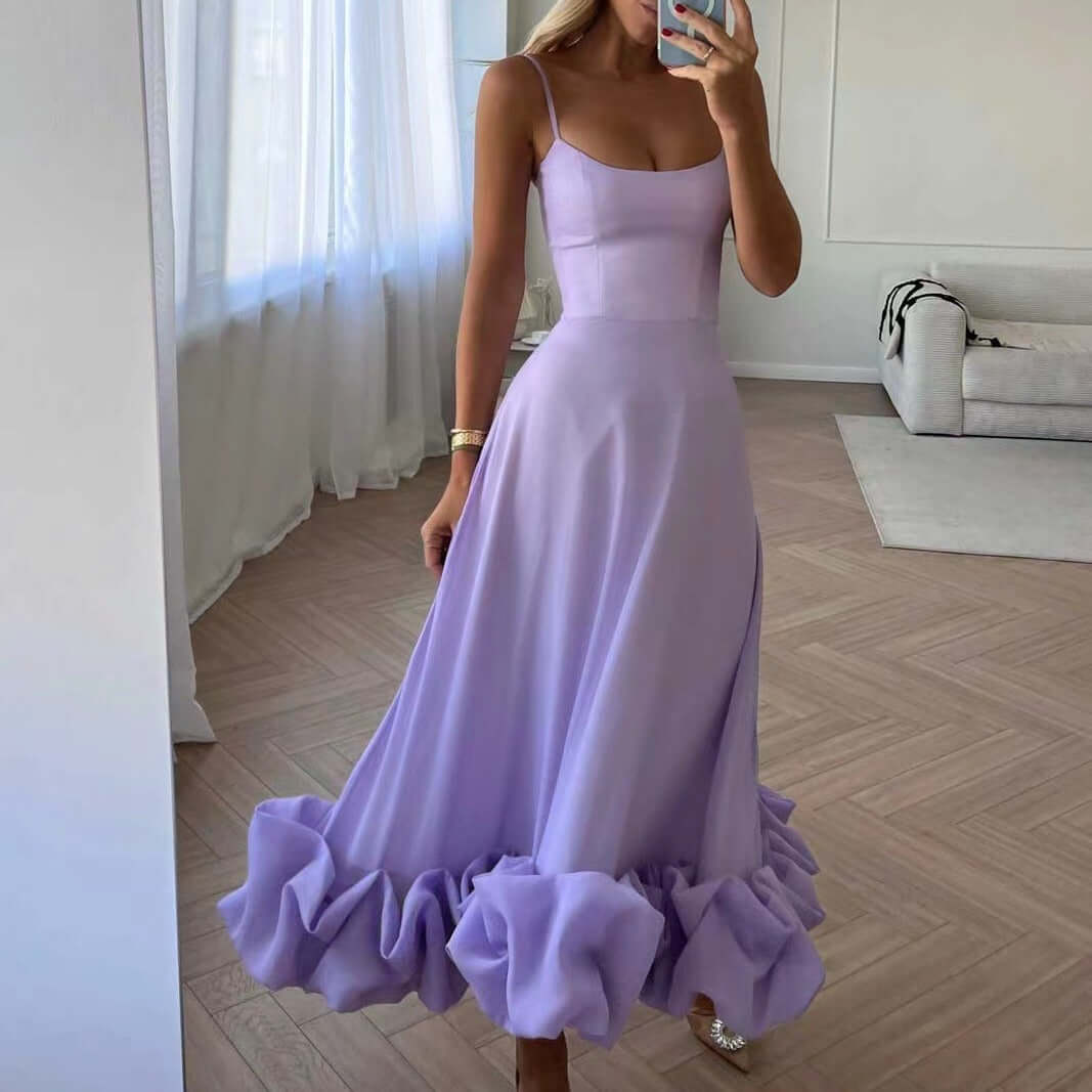 Stylish lavender A-line dress with ruffled hem and spaghetti straps, perfect for elegant occasions.