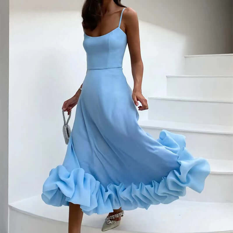 Elegant blue dress with ruffled hem, showcasing a stylish silhouette perfect for special occasions.