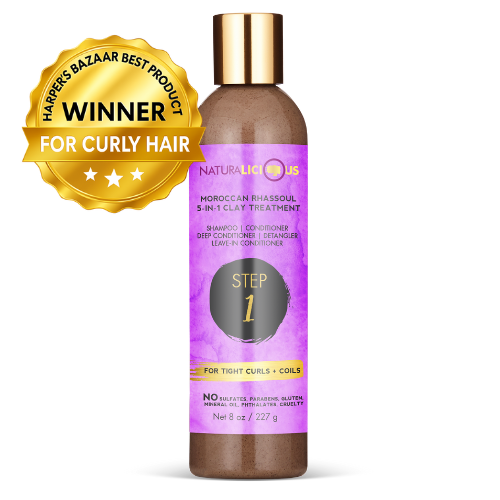 Hair treatment product with purple label and gold cap on a white background, featuring a 'Harper's Bazaar Best Product' award.